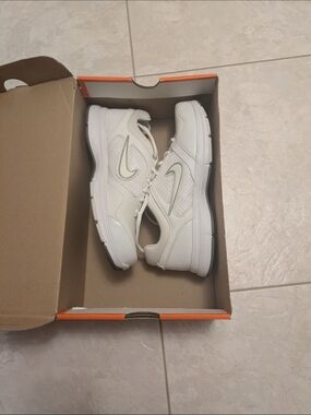 Nike White Sneakers with Silver Swoosh